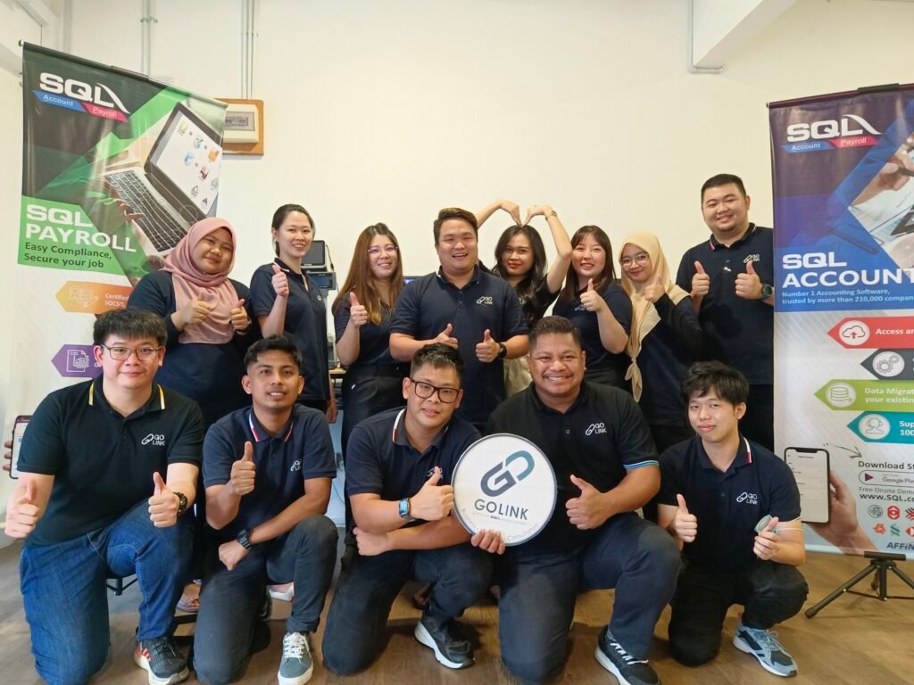 a happy team that promote sql business solutions in sarawak