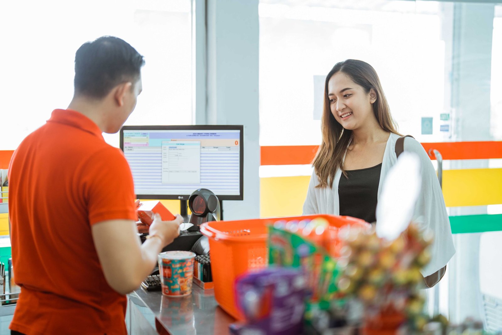 female customer waiting for male shopkeeper counting shopping items using sql account system